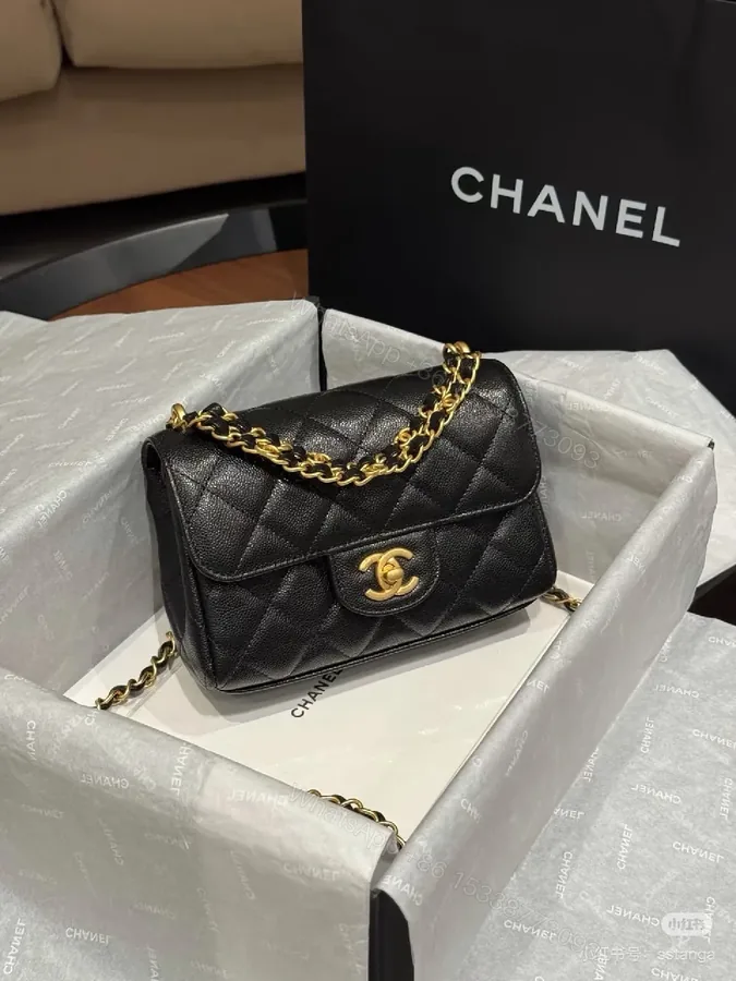 View 1 of Black Quilted Calfskin Flap Bag with Gold Chain - Compact Luxury Bag
