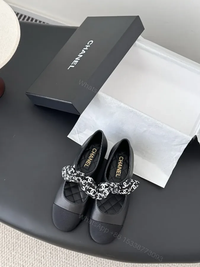 View 1 of Black Quilted Ballet Flats with Logo Bow - Chic, Comfortable Flats