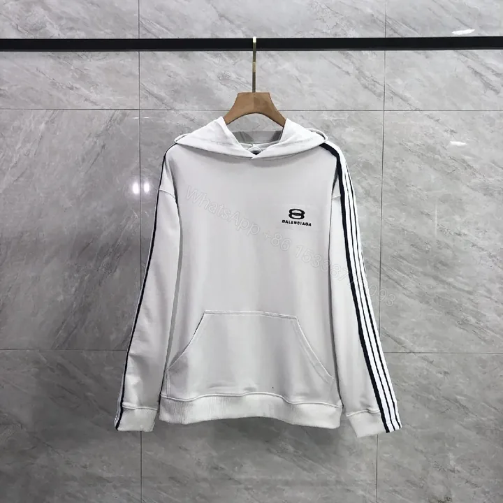 View 1 of Minimalist Sporty Hoodie with Striped Details in Knit Comfort