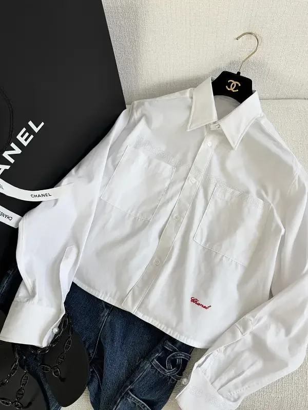 View 1 of White Cotton Shirt Cropped Style with Red Embroidered Chanel Lettering Shirt