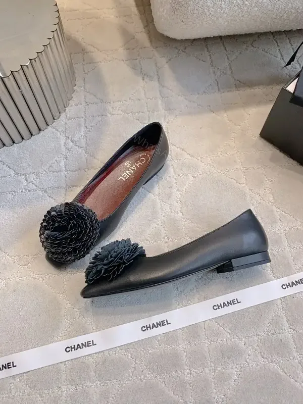 View 1 of Chic Black Pointed Flats with Floral Pom-Pom Detail
