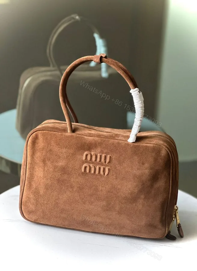 View 1 of MIU MIU suede zip-around bag