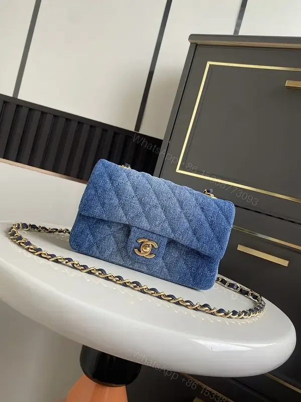 View 1 of Light Blue Denim Quilted Flap Bag with Gold CC Chain Strap