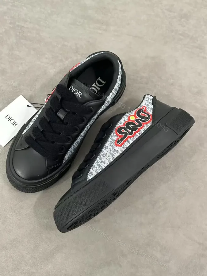 View 1 of Bold Leather High-Top Sneakers with Red Script Graphic