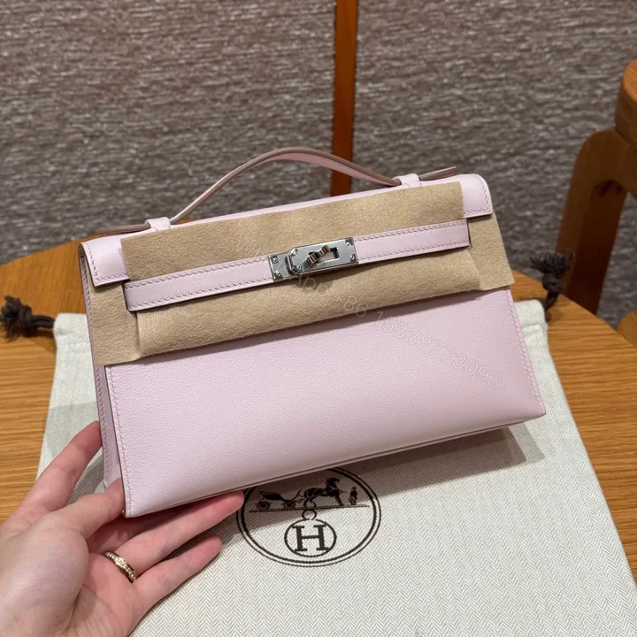 View 1 of HERMES KELLY POCHETTE 22 IN LIGHT PINK SILVER HARDWARE