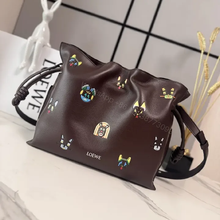 View 1 of Dark Leather Crossbody: Playful Animal Motifs, Compact Chic