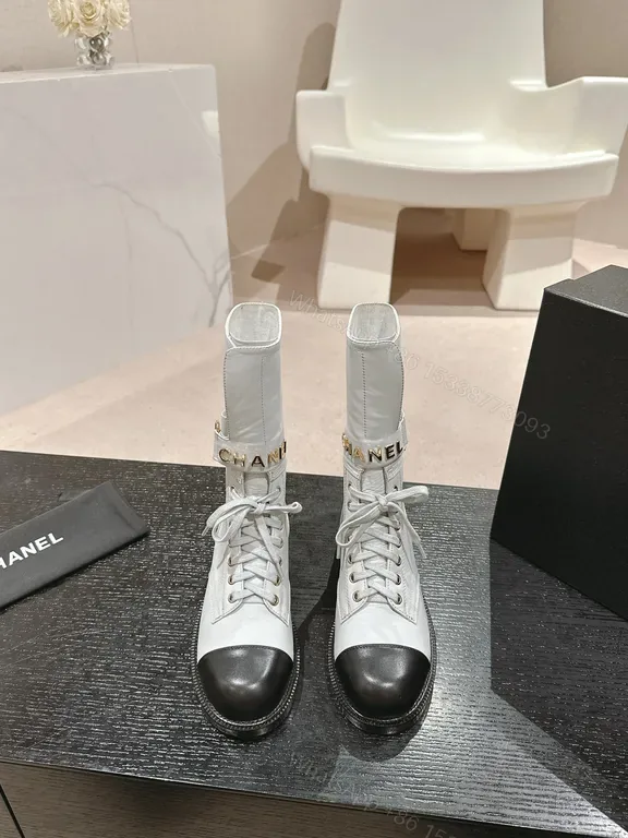 View 1 of Stark Contrast Combat Boots: Chanel-Inspired Luxe Silhouette
