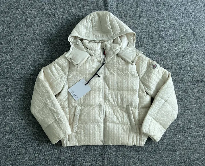 View 1 of Quilted Off-White Hooded Jacket: Lightweight Warmth, Premium Structure
