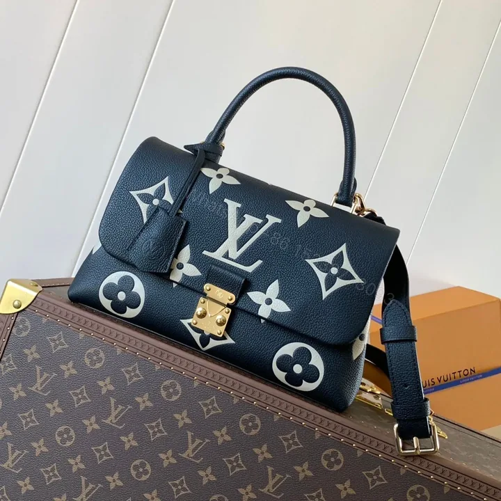 View 1 of LV MADELEINE 30 IN BLACK MIX WHITE MONOGRAM CALFSKIN EMBOSSED LOGO
