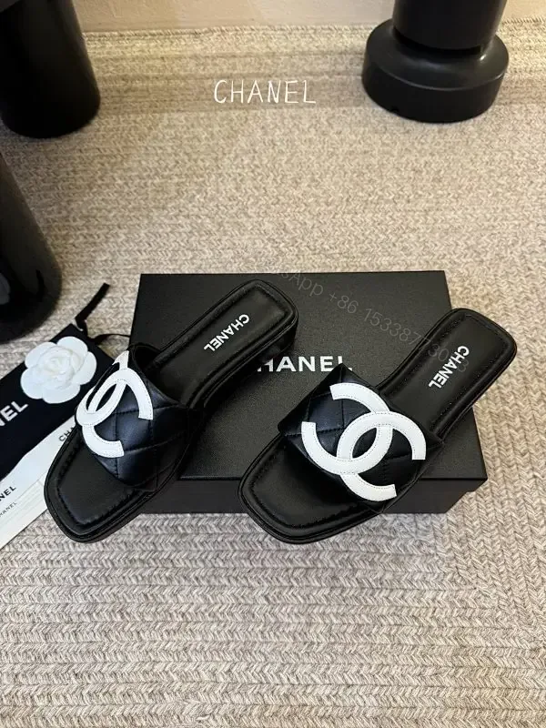View 1 of Interlocking Logo Slip-Ons: Black & White Luxury Sandals