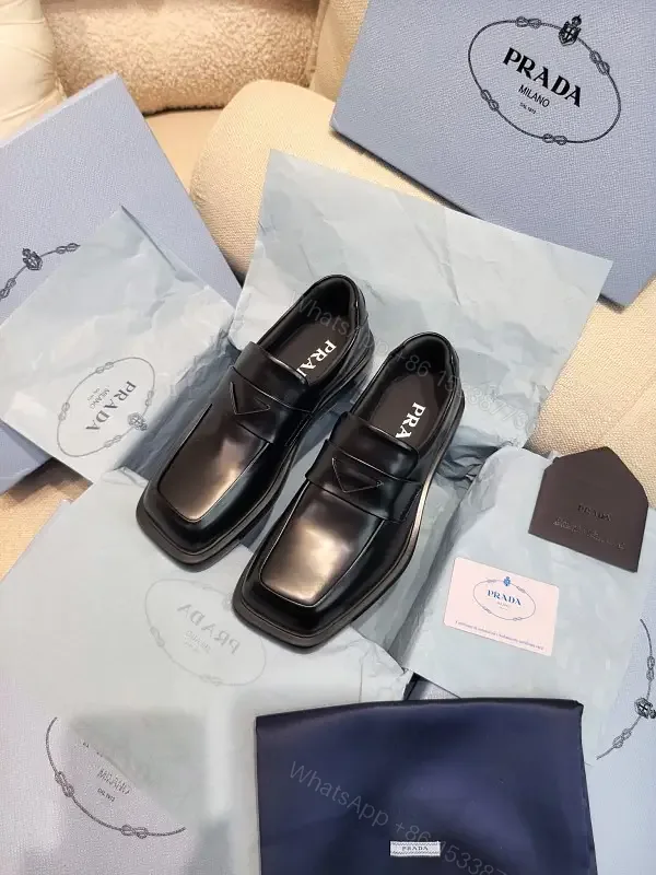View 1 of Black Leather Prada Muffin-Style Loafers - Minimalist Square Toe