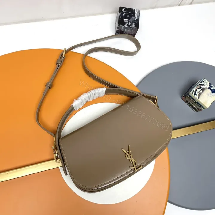View 1 of Taupe Leather Saddle Bag with Subtle Designer Hardware