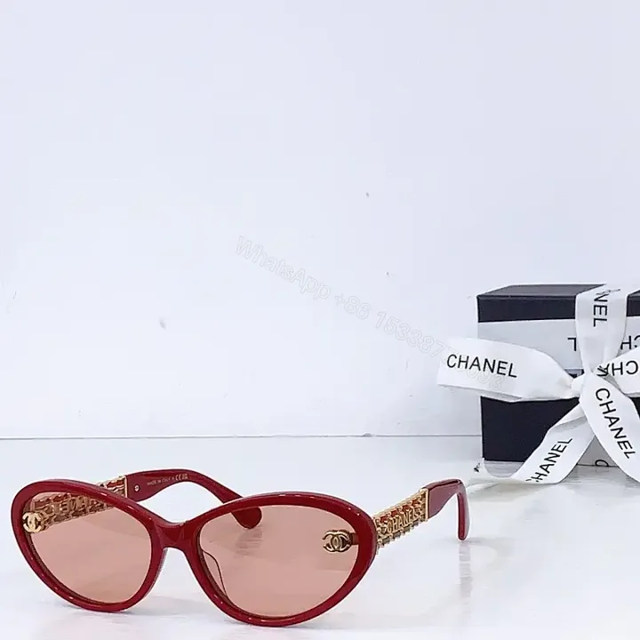 View 1 of Bold Red Cat-Eye Sunglasses with Gold Hardware Detailing