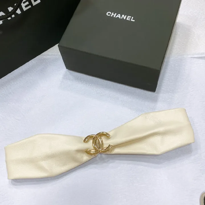 View 1 of Ivory Faux Leather Headband with Gold Logo Emblem - Chic, Everyday Glam