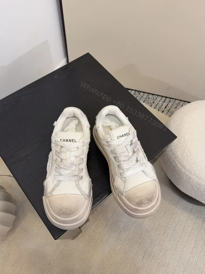 View 1 of White Leather Chunky Sneaker with Textured Panels, Signature Stitching