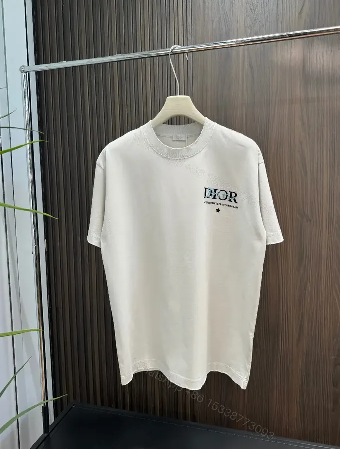 View 1 of Minimalist Logo Tee: Elevated Everyday Comfort, Off-White, Cotton Blend, Relaxed Fit, Short Sleeve Tee