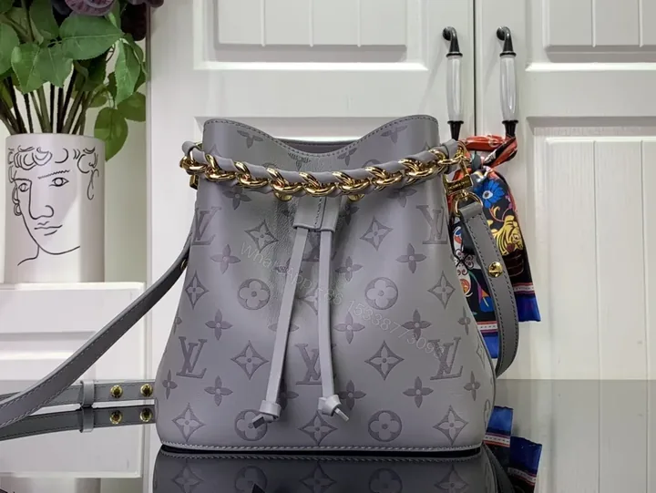 View 1 of Chic Monogram Bucket Bag: Gray Leather, Chain Accent, Versatile Luxury