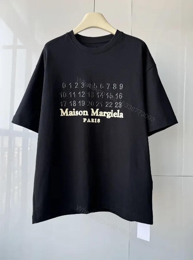 View 1 of Oversized Black Tee with Embossed Numeric Grid - Modern Graphic Comfort