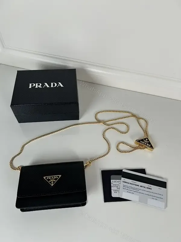 View 1 of Compact Crossbody Bag: Black Leather, Gold Chain, Minimalist Luxe