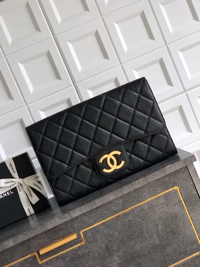 View 1 of Quilted Black Clutch with Gold-Accent Hardware Luxury Compact