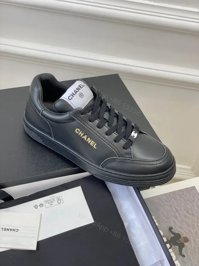 View 1 of Black Leather Sneakers, Subtle Gold Accents, High-Top Style, Everyday Luxury