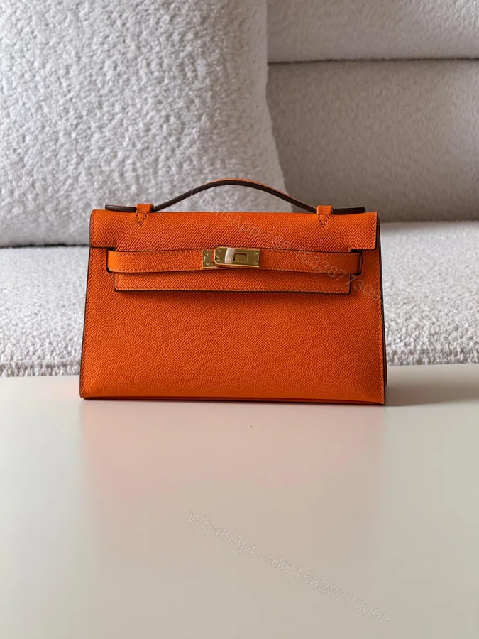 View 1 of Hermes Kelly Orange Pochette Bag