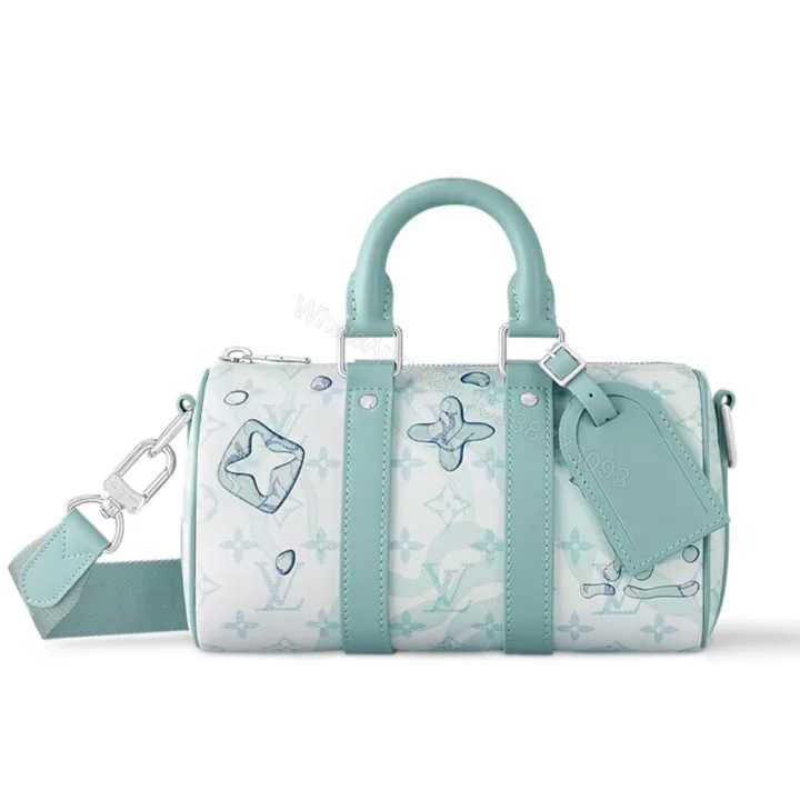 View 1 of Louis Vuitton Keepall Bandouliere Crystal Green 25Cm M22527