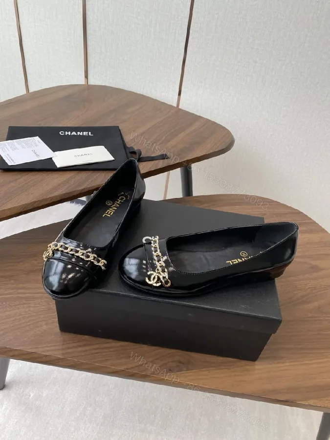 View 1 of Black Leather Ballet Flats with Gold Chain Hardware
