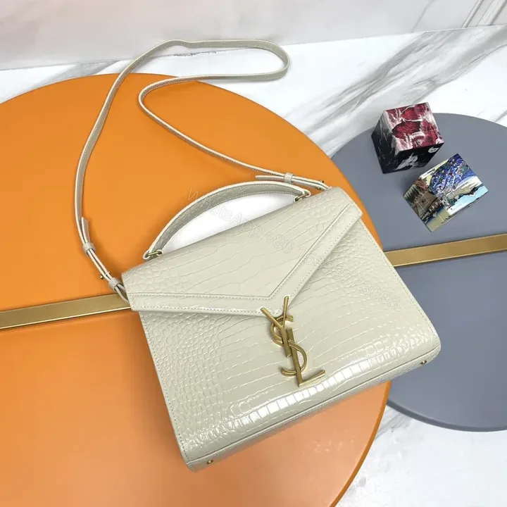 View 1 of Ivory Croc-Embossed Leather Bag with Gold YSL Logo, Structured Style