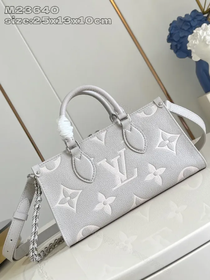 View 1 of Monogram Embossed Leather Tote: Structured Luxury Bag