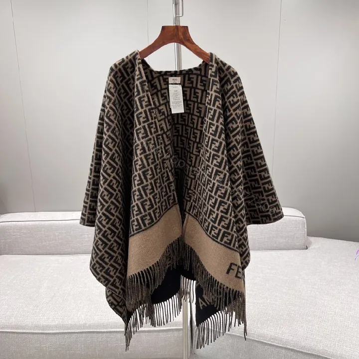 View 1 of Neutral Knit Poncho: Luxe Monogram-Patterned, Fringed, All-Season