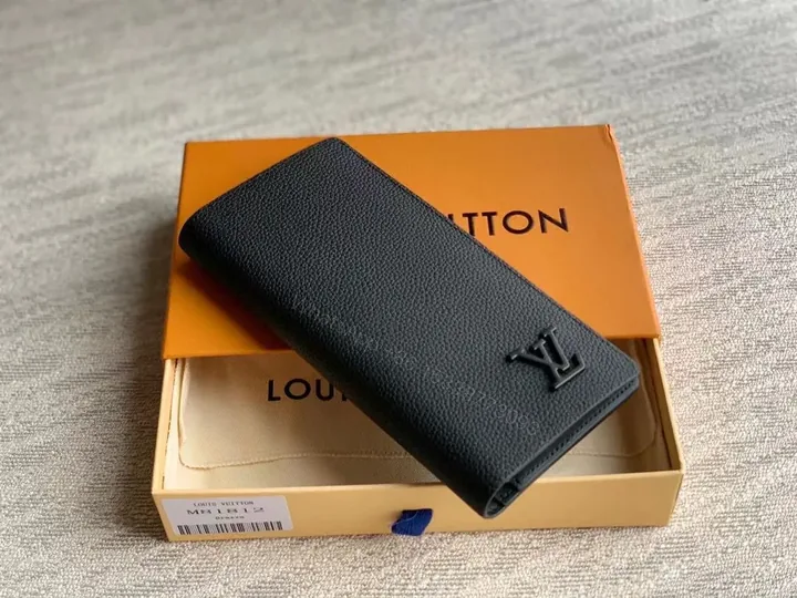 View 1 of Pristine Black Leather Wallet â€” Subtle LV Emblem, Organized