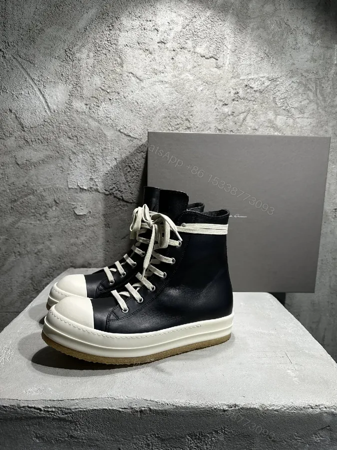 View 1 of Black Leather High-Top Sneakers with Off-White Accents