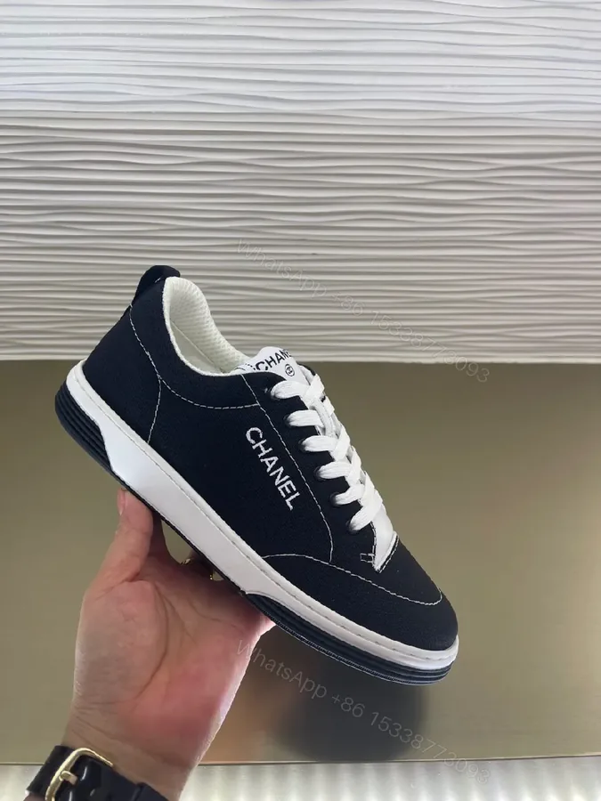 View 1 of Navy Canvas Low-Top Sneaker: Subtle Luxe, Everyday Comfort