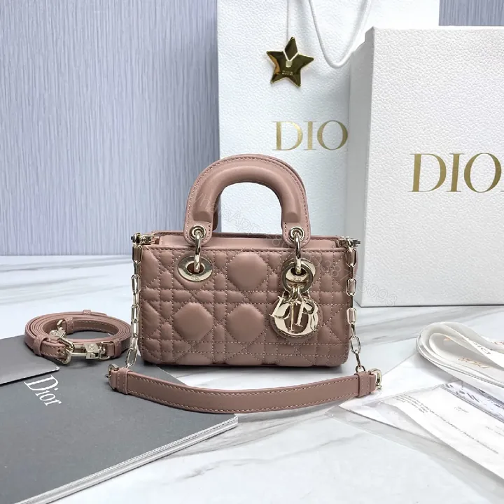 View 1 of Soft Pink Quilted Mini Crossbody with Gold Charms - Compact Luxury Bag