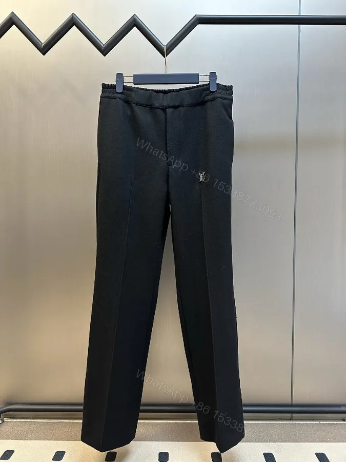 View 1 of Minimalist Tailored Trousers: Subtle LV Monogram Detail