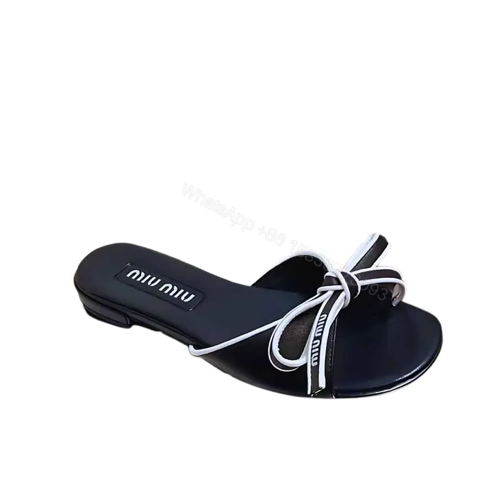 View 1 of MIUMIU MORDORÉ NAPPA SANDALS WITH BOW BLACK