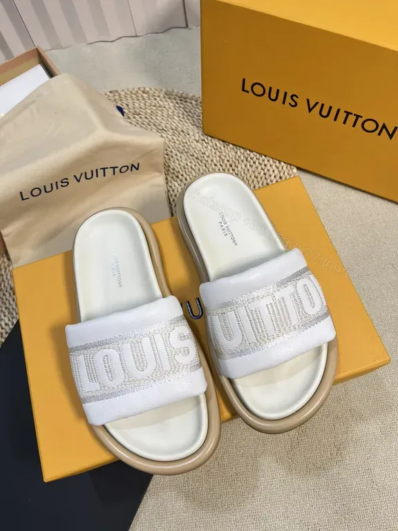View 1 of Louis Vuitton Luxe Textured Slides with Logo Embellishment