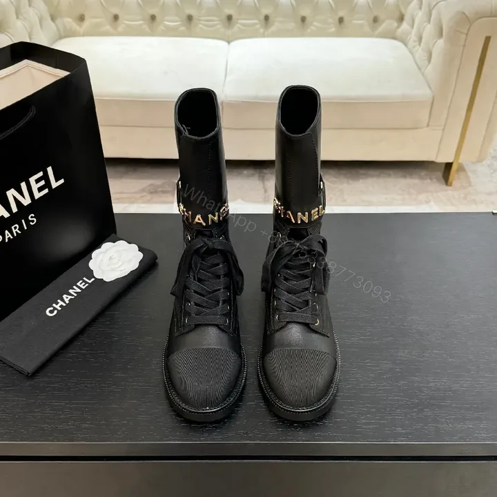 View 1 of Chic Black Combat Boots with Gold Detailing - High-Top Style