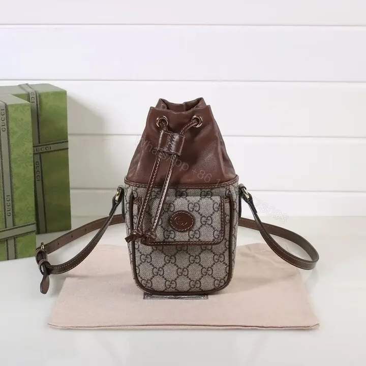 View 1 of GUCCI GG Supreme Mini Leather-Trimmed Bucket Bag