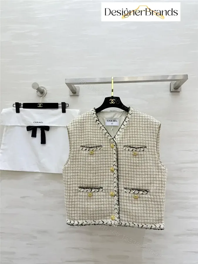 View 1 of Textured Tweed Vest with Gold Button Detailing—Chic Layering Piece