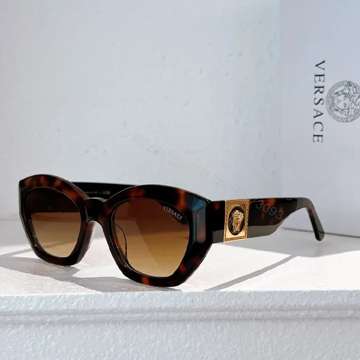 View 1 of Bold Tortoise Cat-Eye Sunglasses with Gold Medallion Accents
