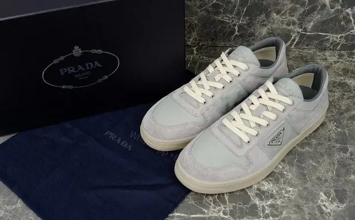 View 1 of White Leather Suede Low-Top Sneaker with Prada Logo Cardboard Mountain Crest