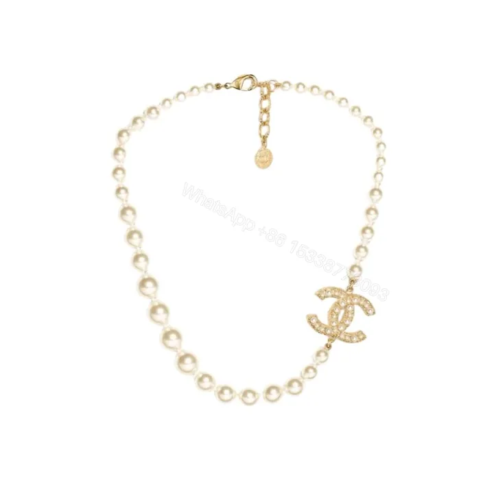View 1 of Chanel Metallic Silver Tone Coco Faux Pearl CC Necklace