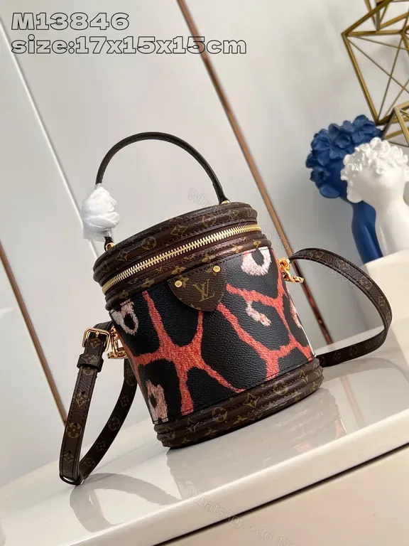 View 1 of Giraffe-Print Coated Canvas Bucket Bag: Luxe, Compact, Versatile