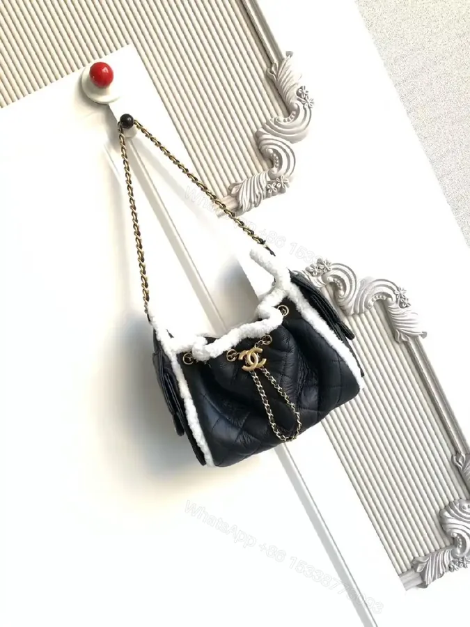 View 1 of Quilted Mini Bag with Faux Shearling Trim - Compact Luxury