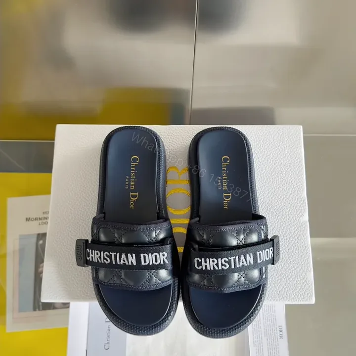 View 1 of Navy Quilted Brand-Accent Sandals | Luxe Streetwear Slides