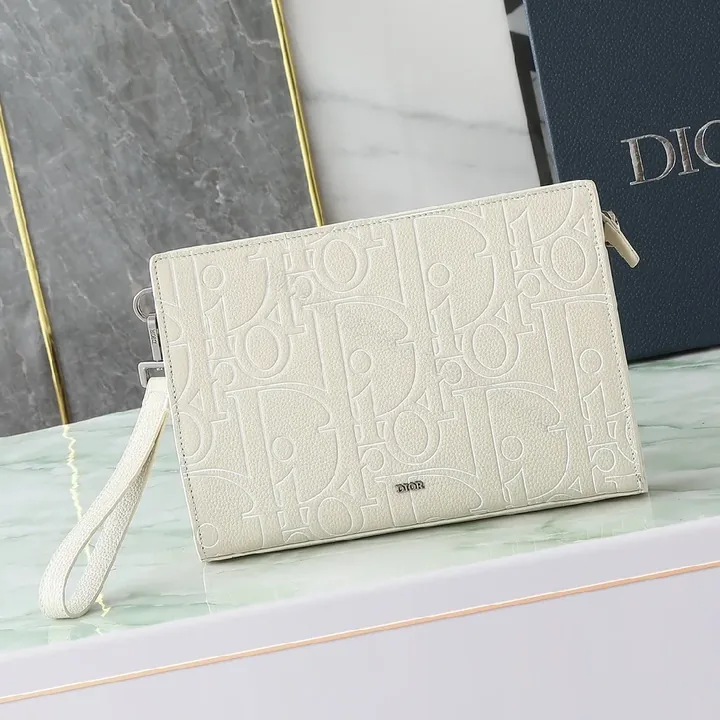 View 1 of Refined Monogram Clutch: Textured Grain, Silver Hardware, Lightweight Crossbody