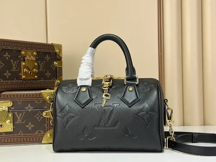 View 1 of Black Pebbled Leather Dome Handbag with Gold Details