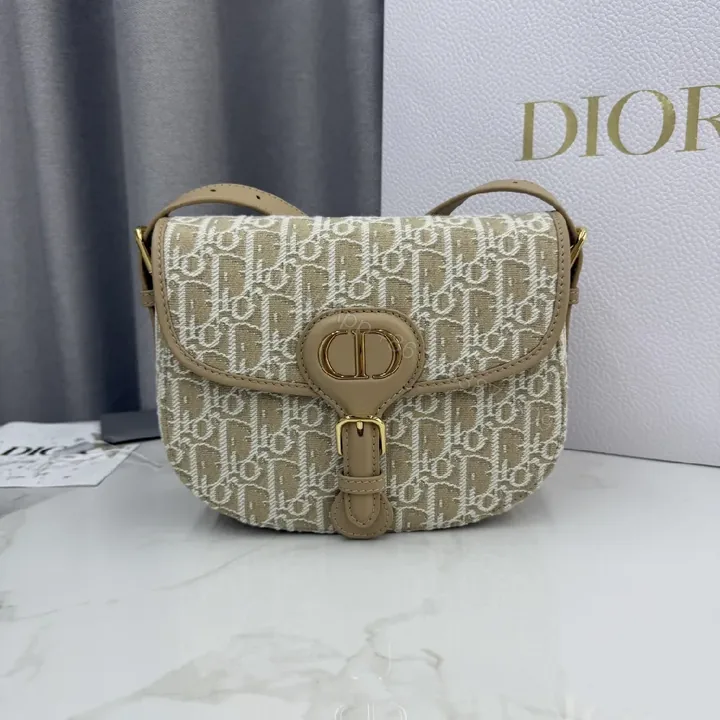 View 1 of Beige Monogram-Textured Leather Mini Shoulder Bag